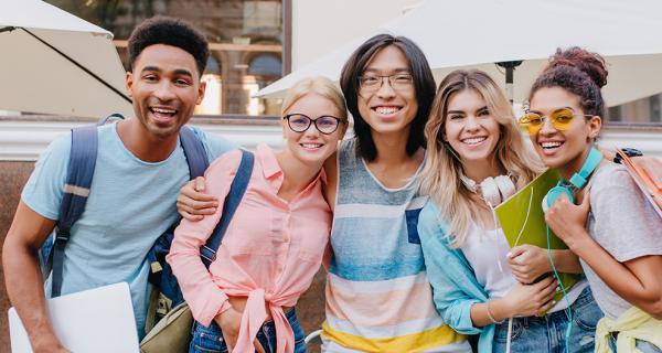 a group of international students outside a cafe