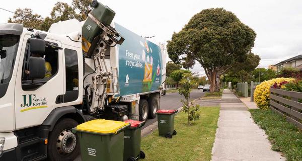 Garbage truck collecting reccyling