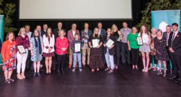 Sports & recreation award recipients hold awards 