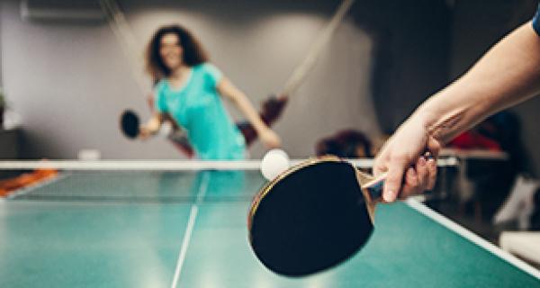 People playing table tennis