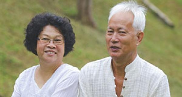 older man and lady smiling