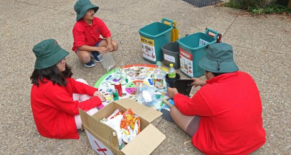 Primary school children sorting waste activity