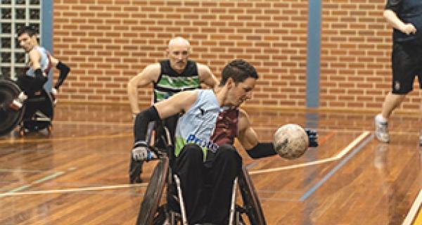 wheelchair rugby player on an indoor basketball court