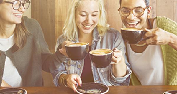 Women at cafe drinking coffees