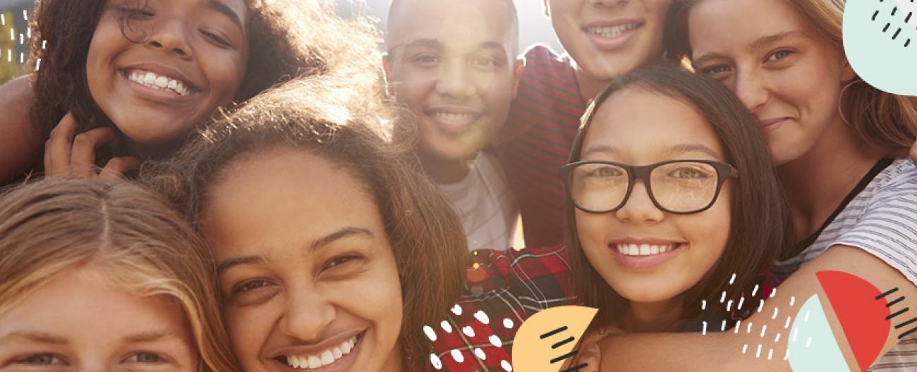 Teens, smiling in a group photo