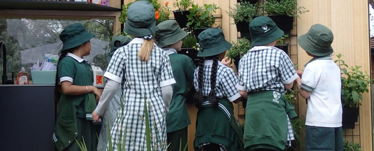 Picture of school children exploring a tiny house