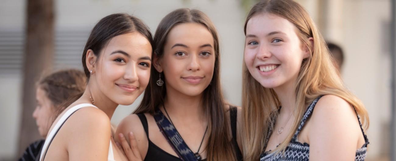 Three young women at an event