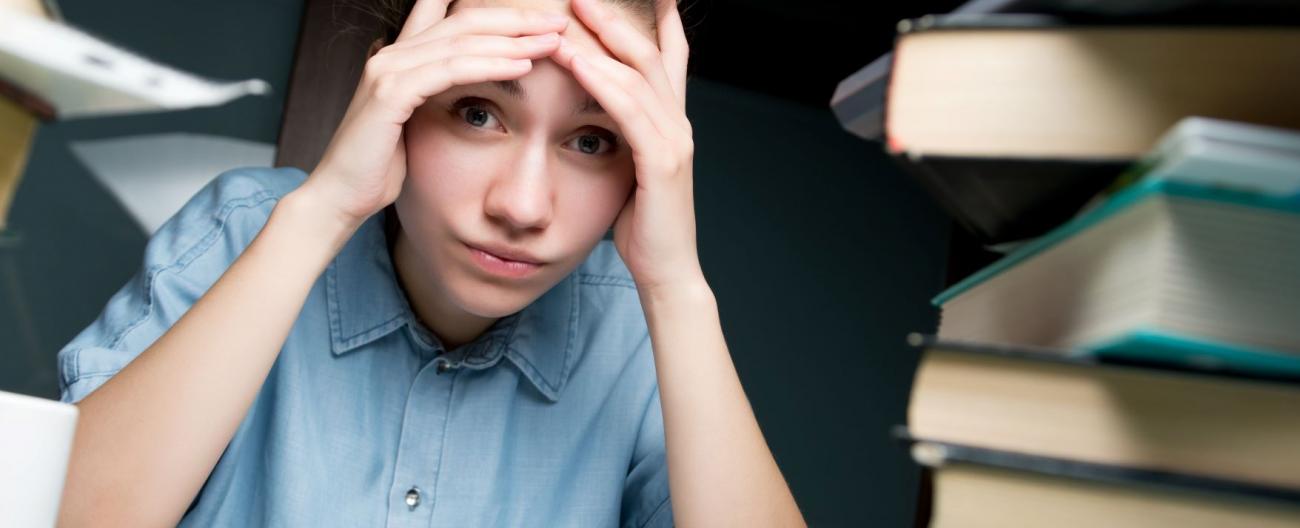 Student looking overwhelmed with homework