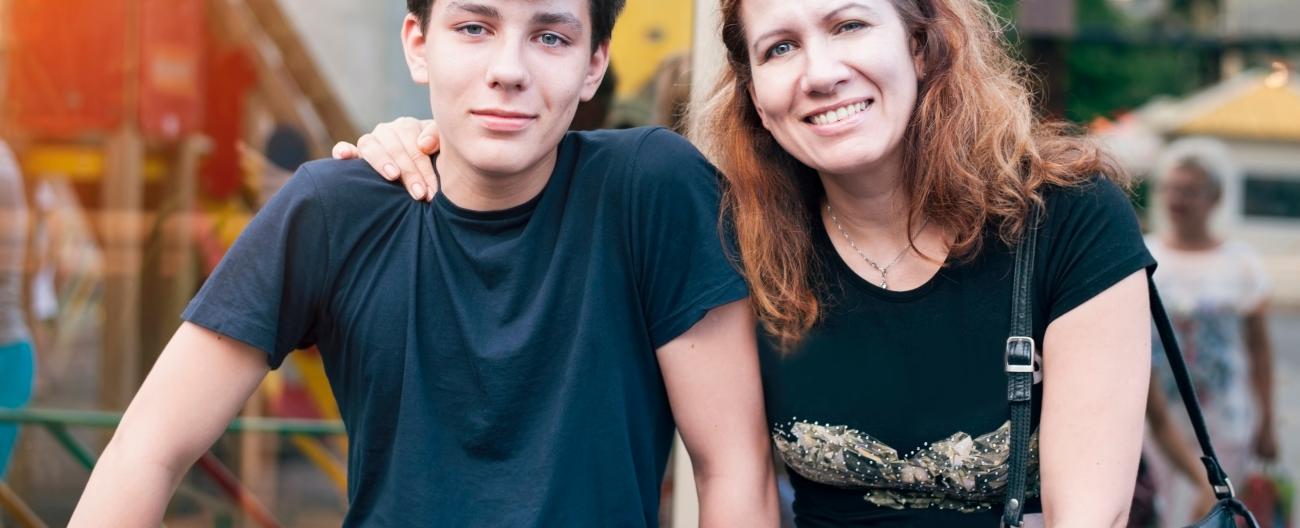 Mother and son sitting together