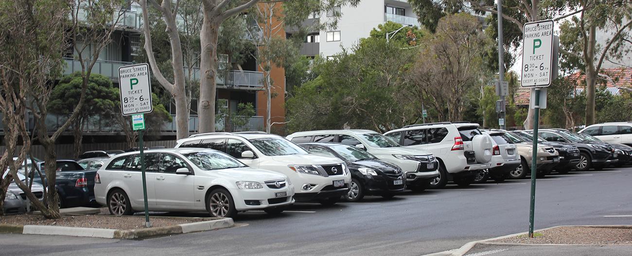 row of cars parked in car park