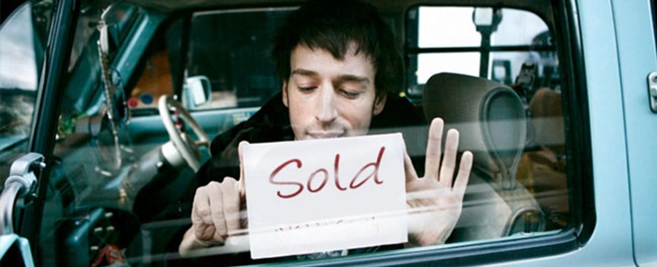 sold sign in car