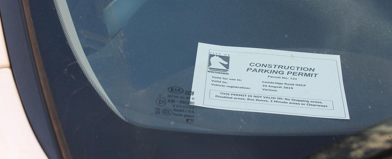 Construction parking permit in windscreen
