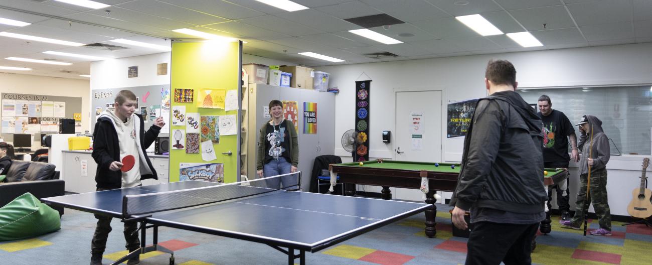 Young people playing table tennis
