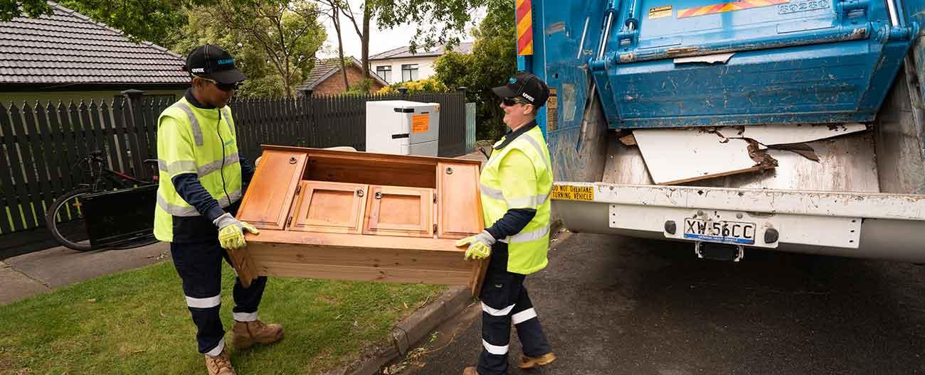 Photo of workers removing hard rubbish