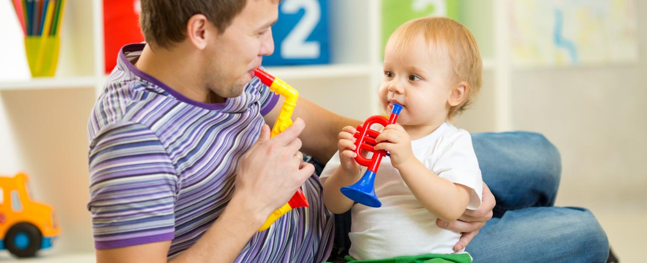 Father and child playing on the floor