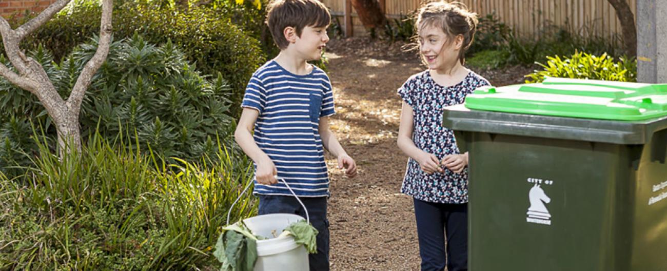 Image of placing waste in garden bin