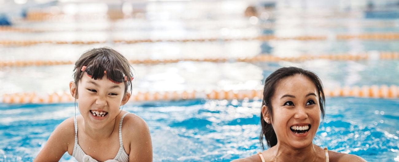 Mum and daughter in pool