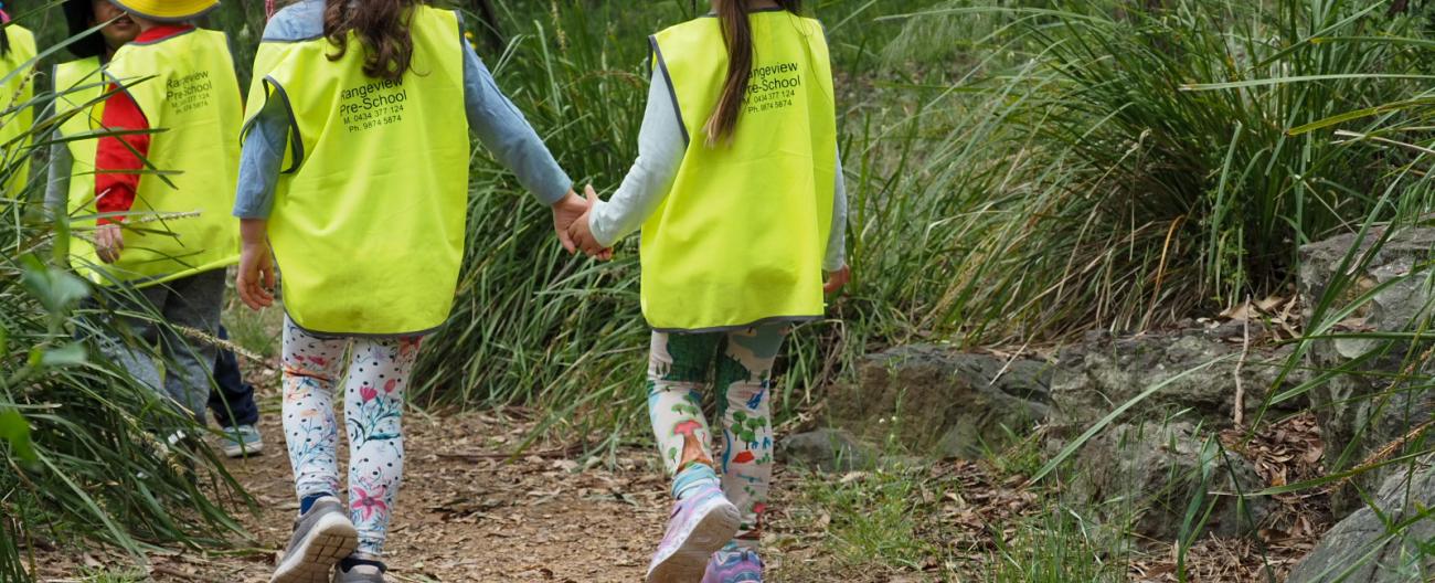 Children walking in the bush at Bush Kinder