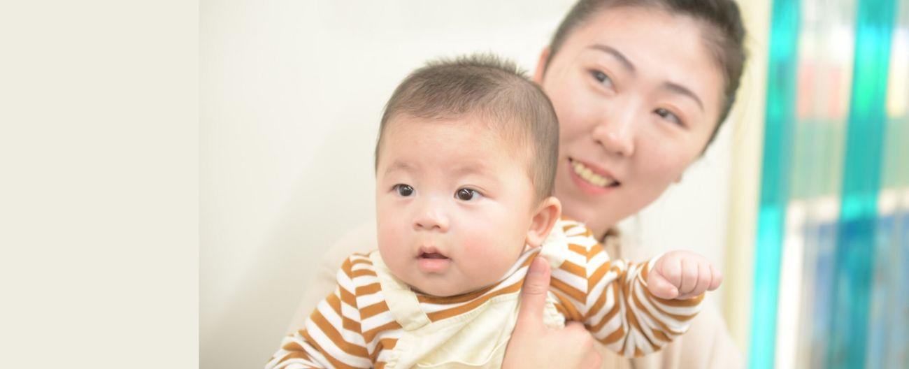 a young Asian mother and her baby