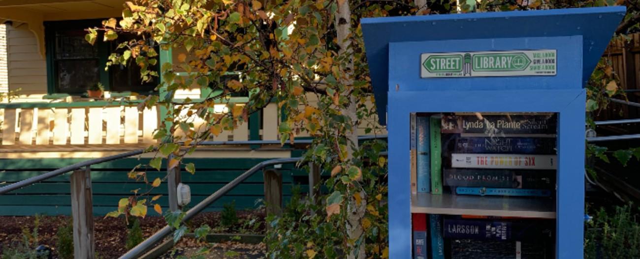 Neighbourhood house with street library at front