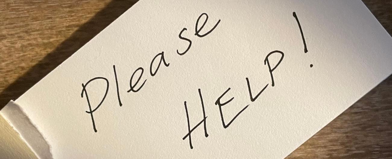 Please help written on card