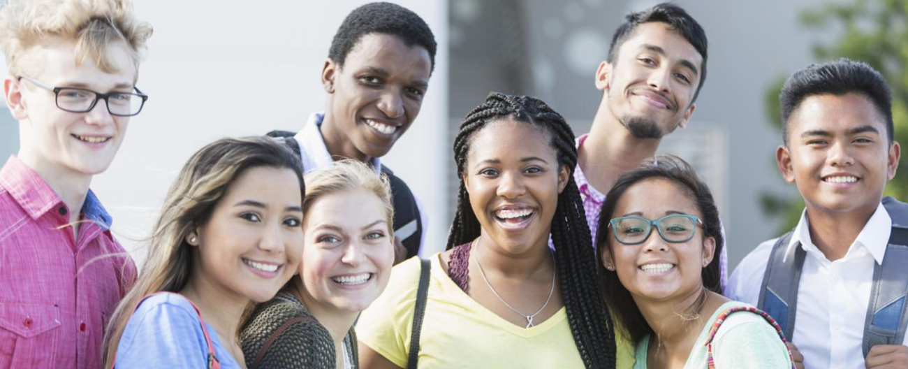 Group of diverse young people hanging out together