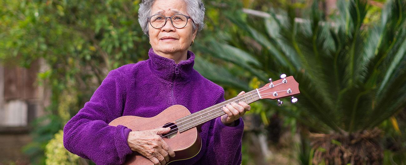 lady playing a ukulele