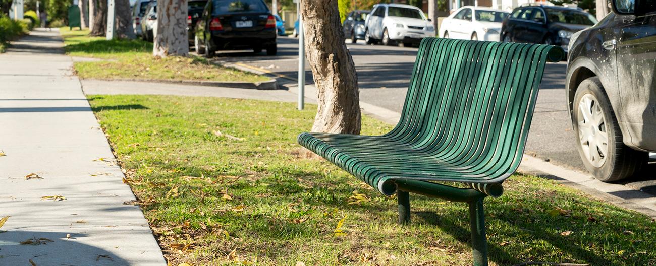 Green bench on the nature strip