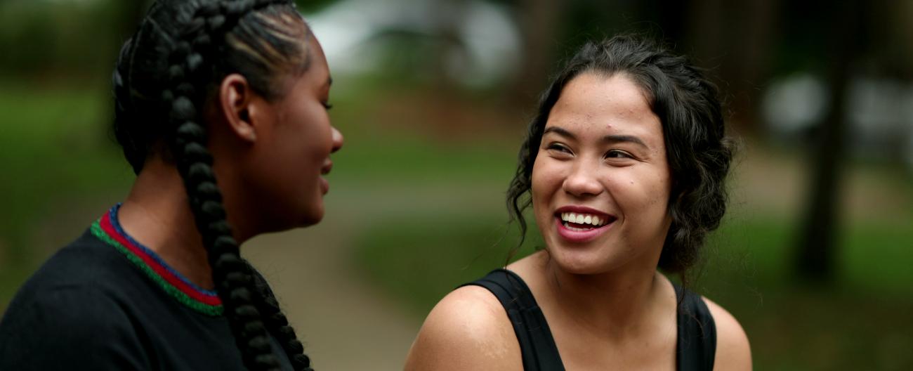 Two young women sharing a laugh