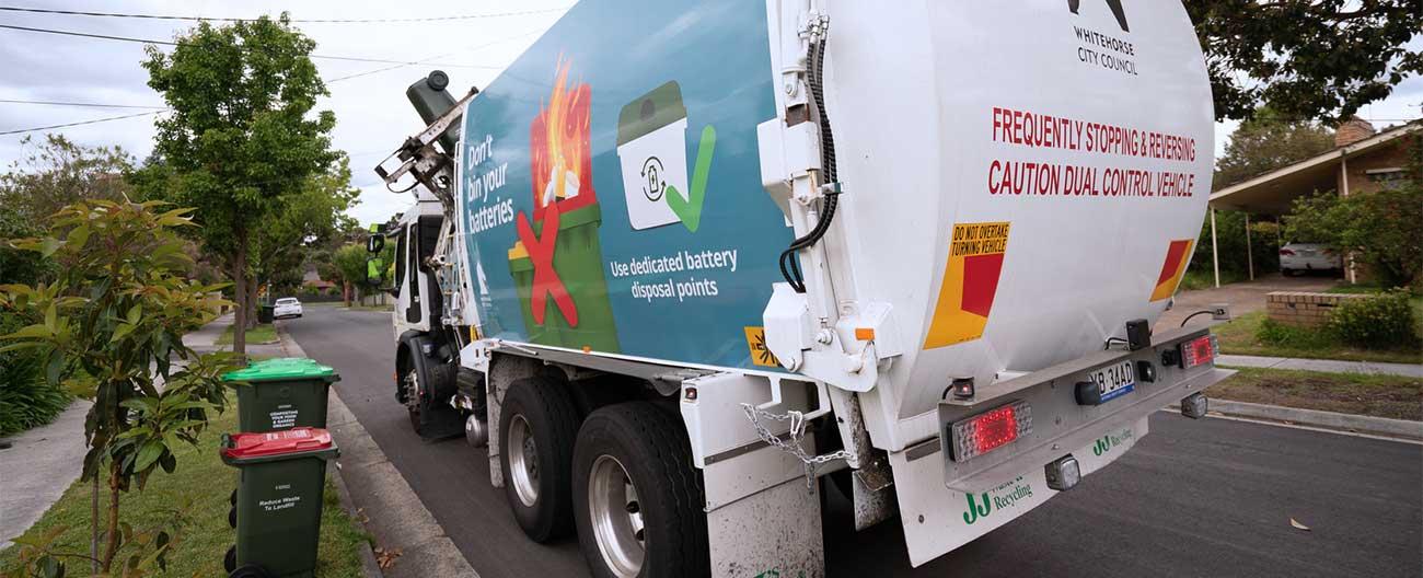 Photo of garbage truck on suburban street