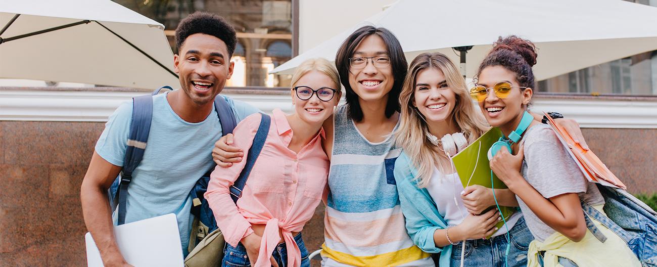 a group of international students outside a cafe