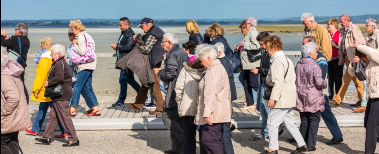Large group of older people at the seaside