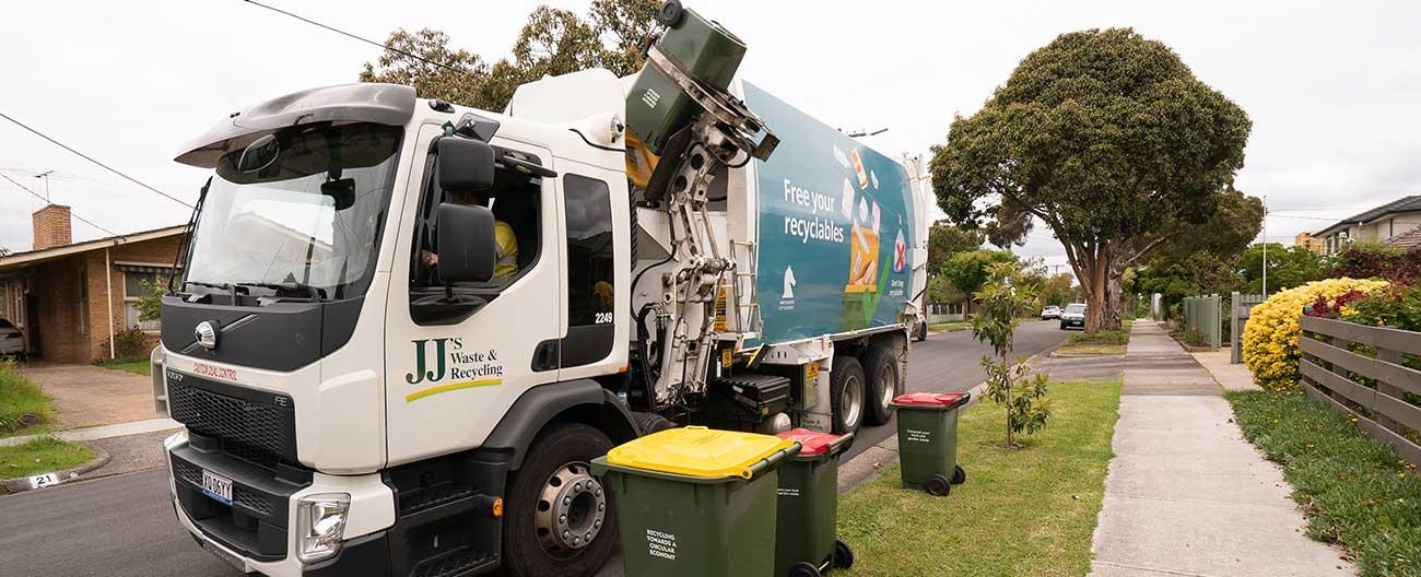 Garbage truck collecting reccyling