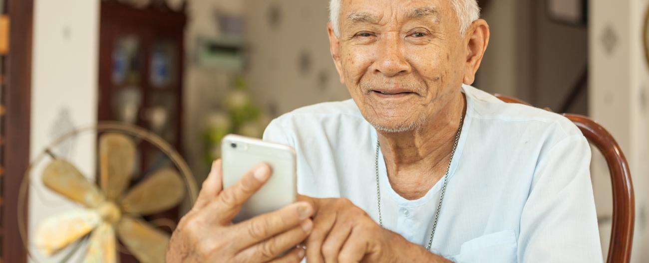 Connect and Support - man using mobile phone