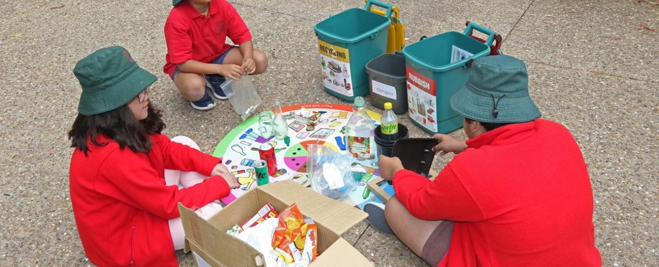 Primary school children sorting waste activity