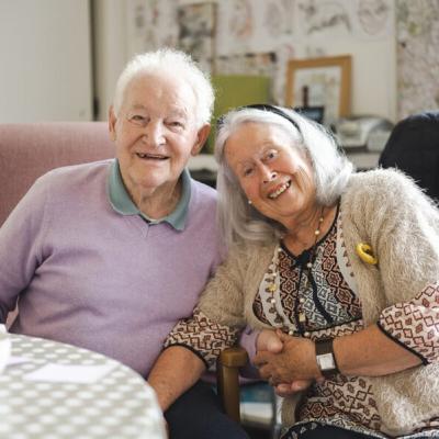 Older male and female at table